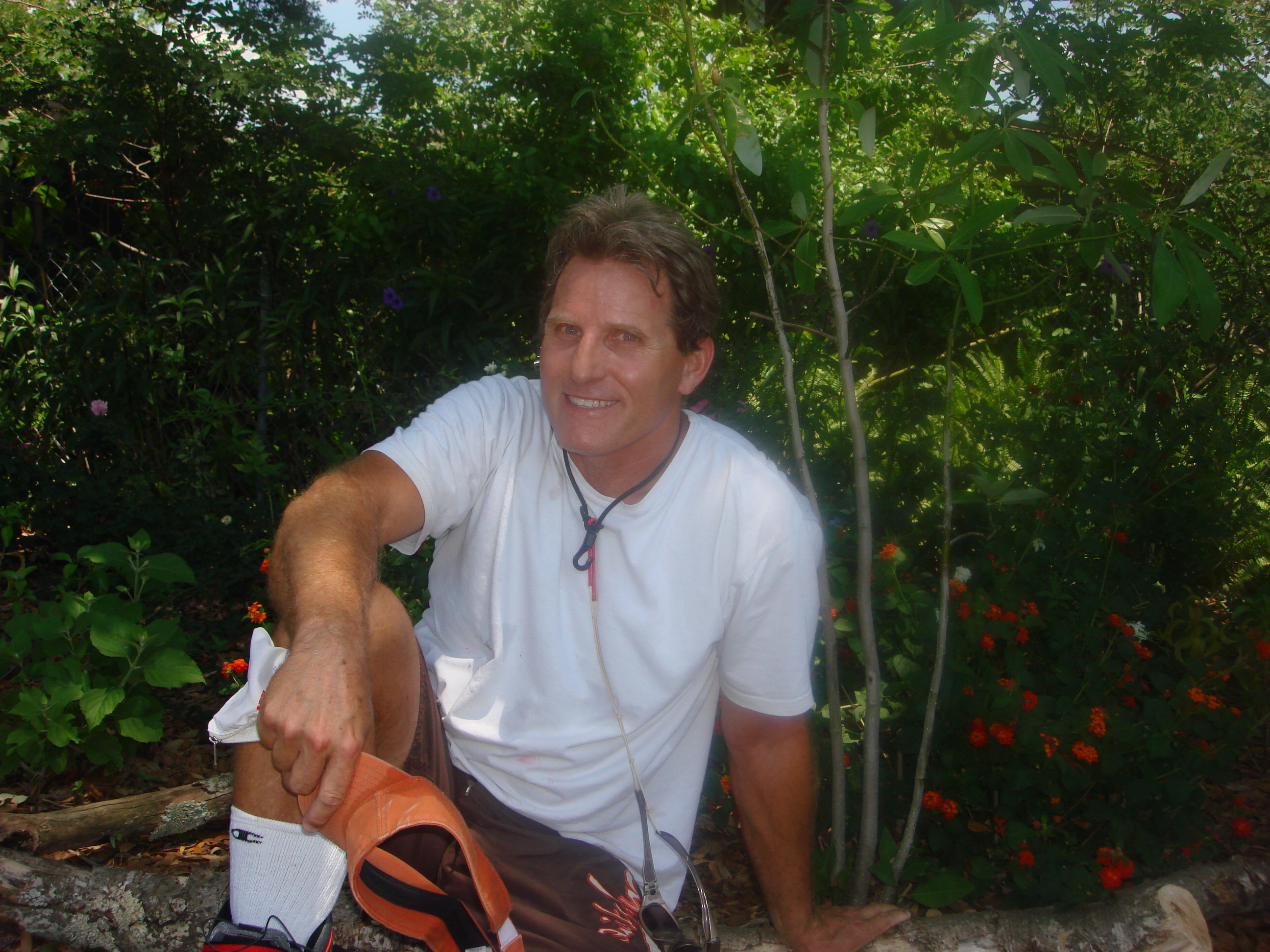 Michael J. Lanser outdoors among garden foliage